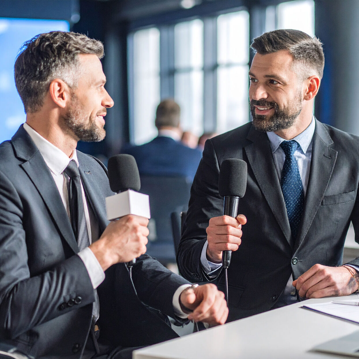 military-man-and-a-business-man-getting-interviewed-at-a-tv-show-studio